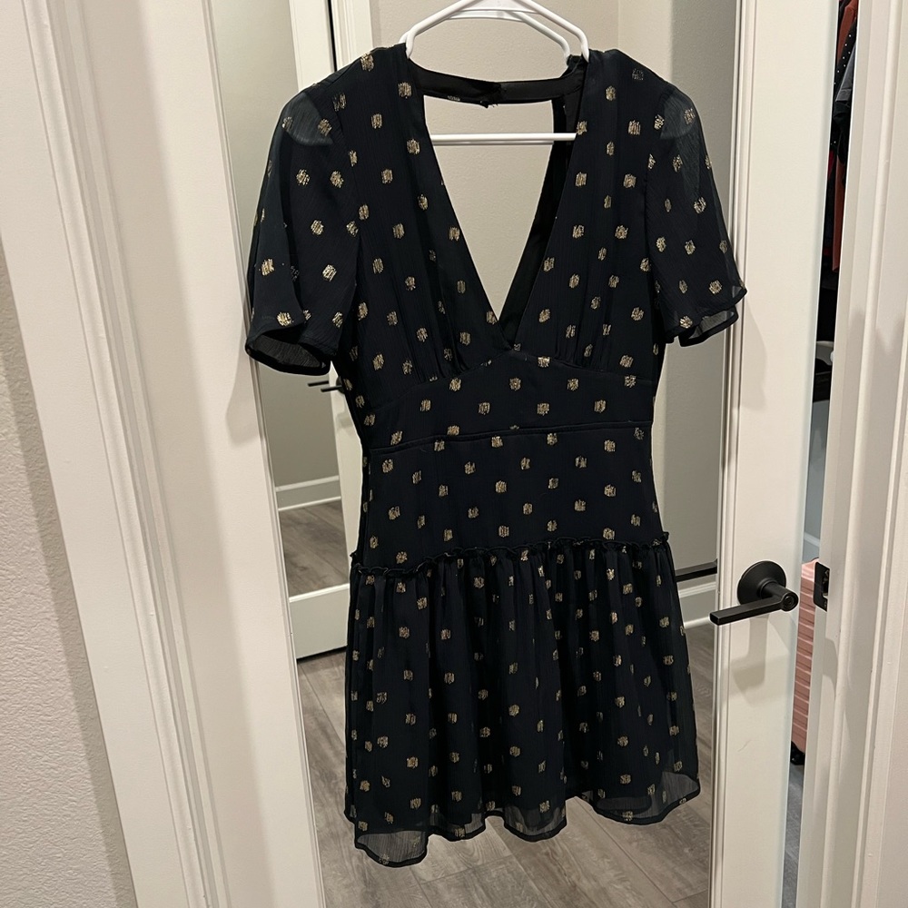 Black and gold polka dot mini dress